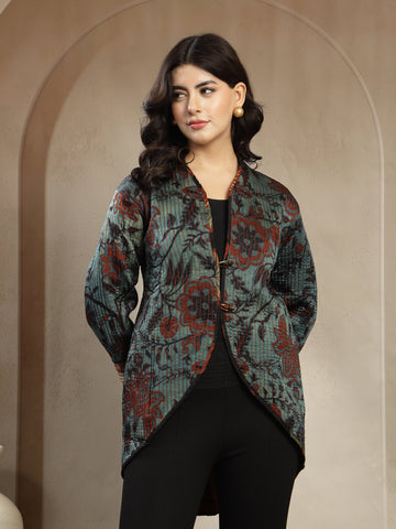 Woman wearing a patterned jacket against a beige background